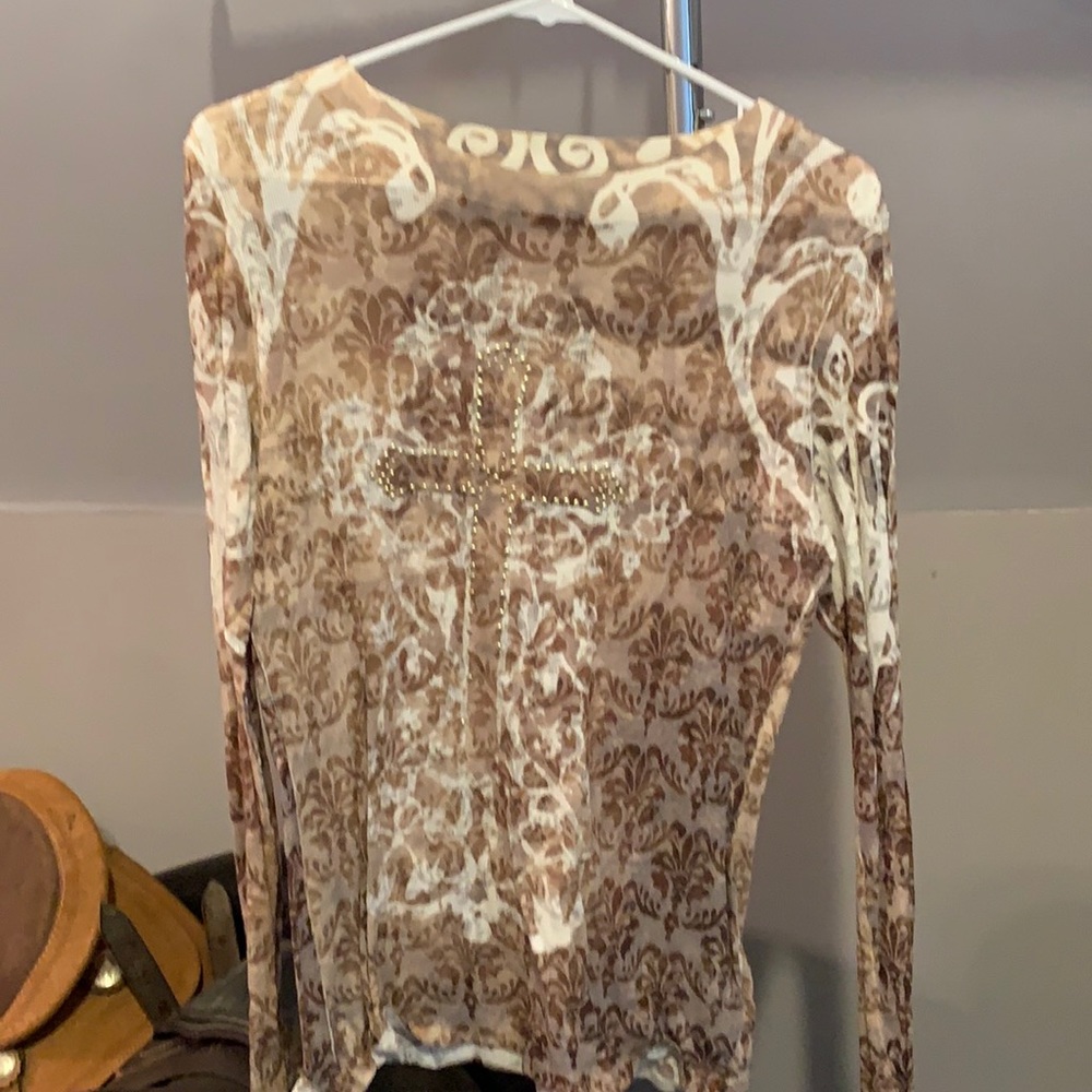 Ladies burn through long sleeve top by Oneworld. Has a cute cross on the chest.